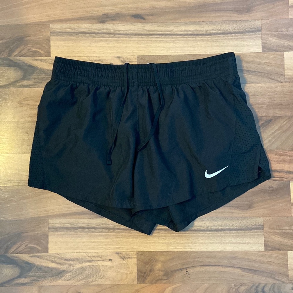 Black NIKE athletic shorts elastic waistband & tie. Loose fit.